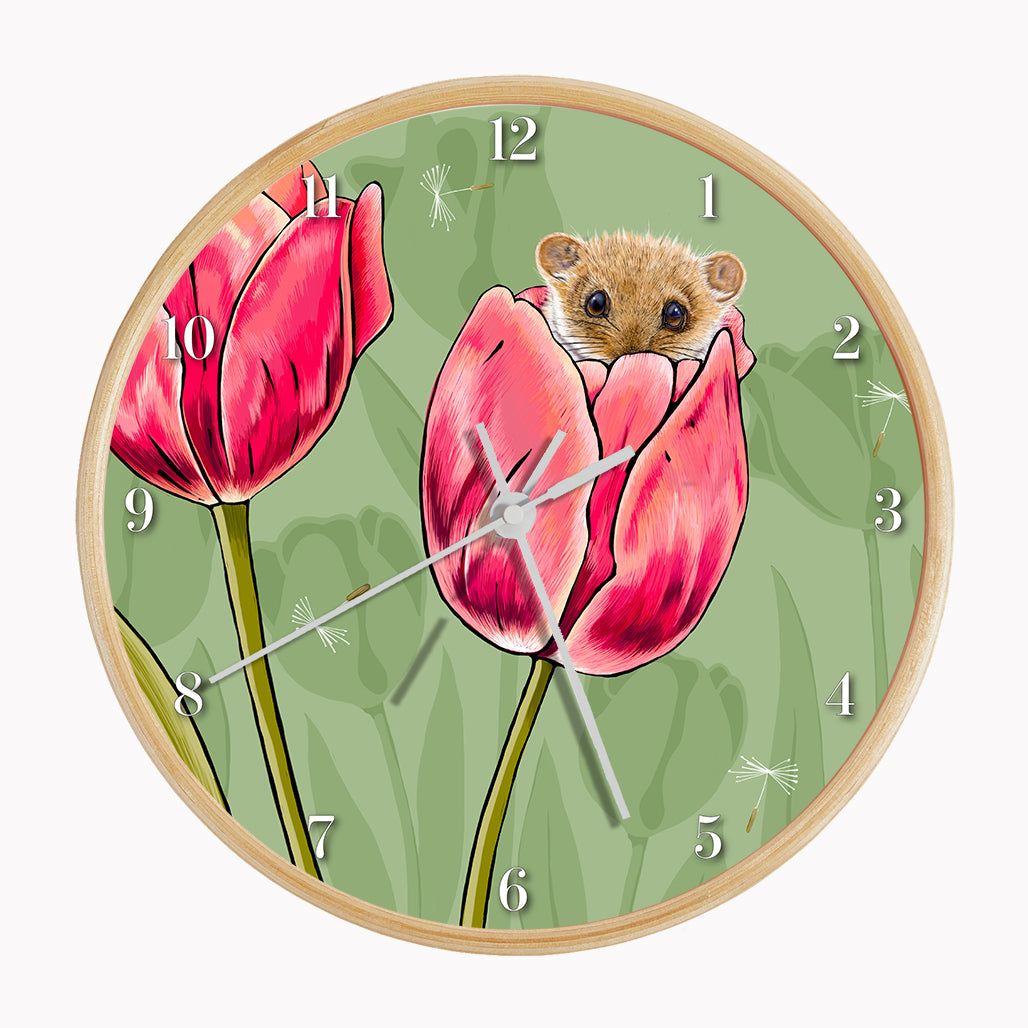 Our sustainable dormouse and tulip wall clock features an illustrated dormouse sitting in a tulip