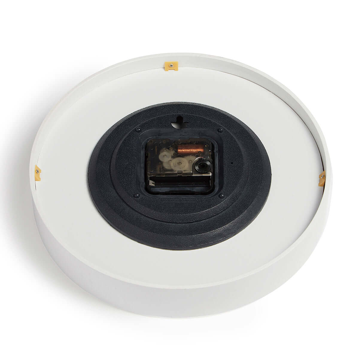 Close up of rear of white bamboo wall clock