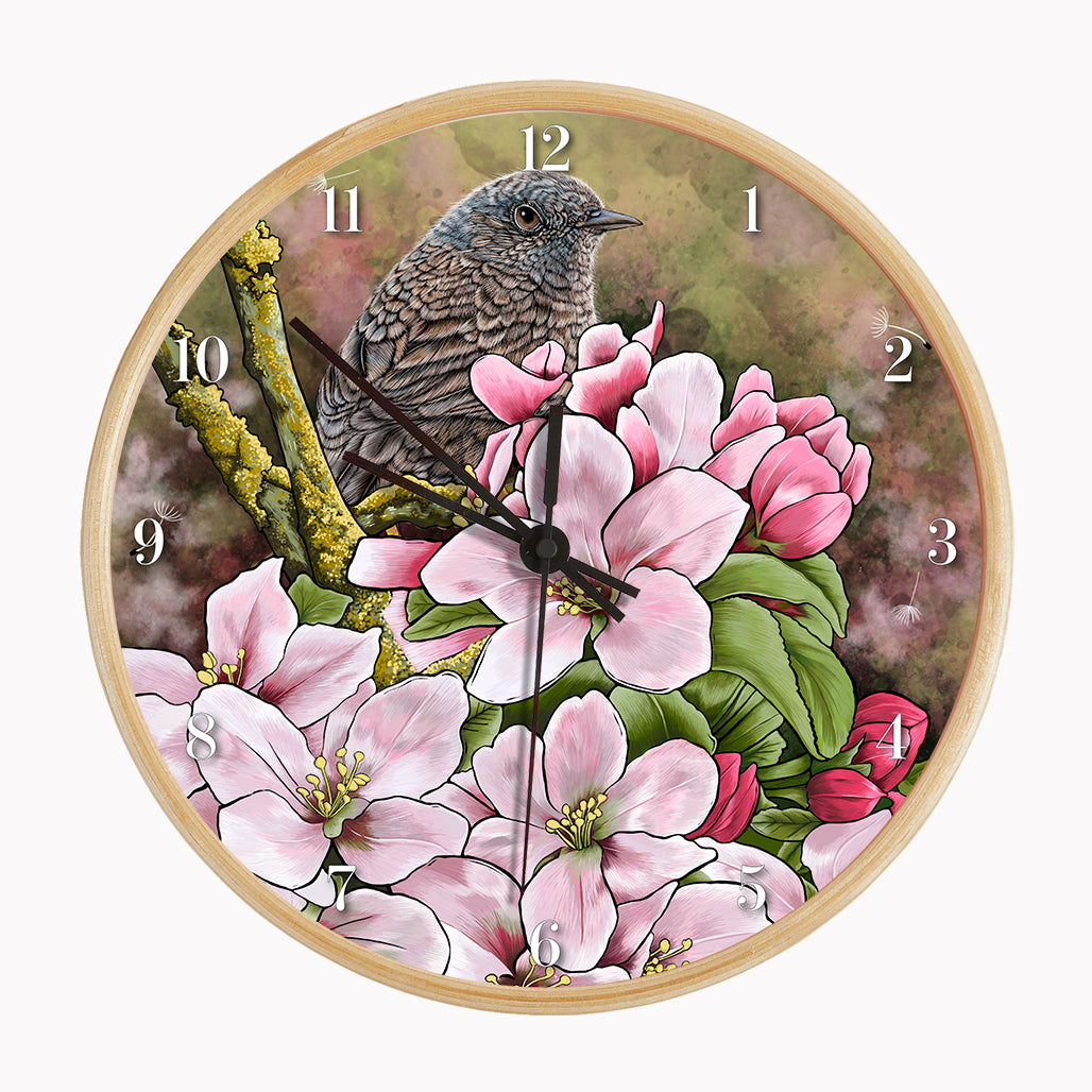 Our sustainable garden bird wall clock features an illustrated Dunnock surrounded by spring blossom