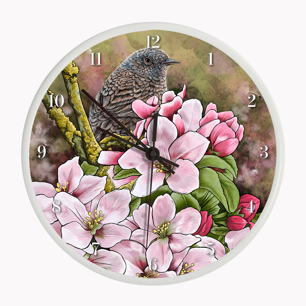 Our sustainable garden bird wall clock features an illustrated Dunnock surrounded by spring blossom
