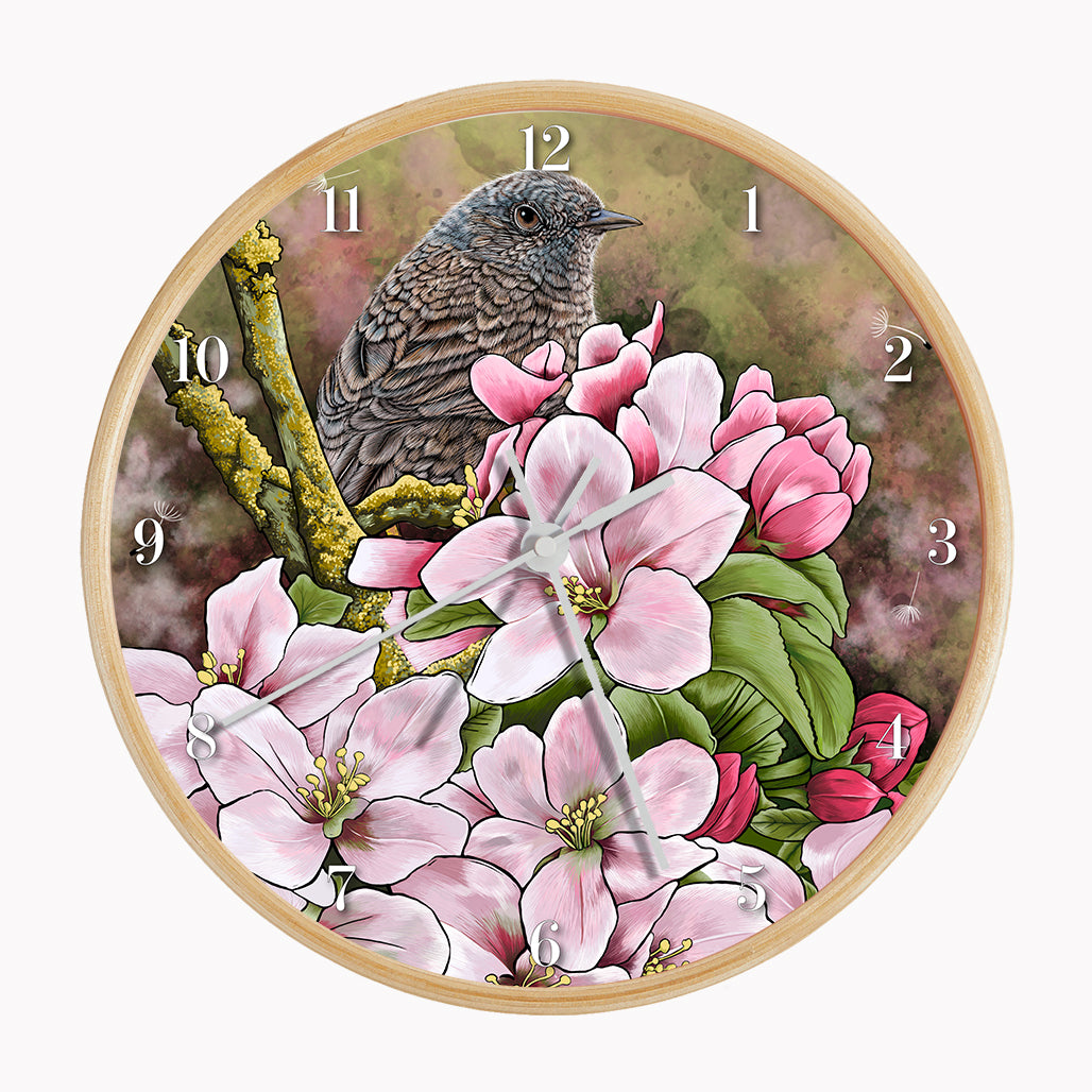 Our sustainable garden bird wall clock features an illustrated Dunnock surrounded by spring blossom