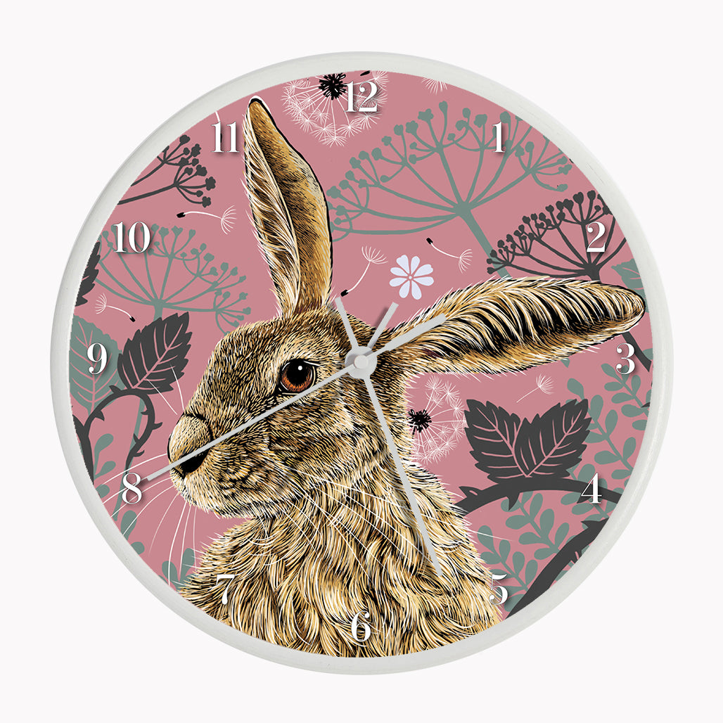 Sustainable hare wall clock - antique rose, hare surrounded by brambles and cow parsley on a pink background