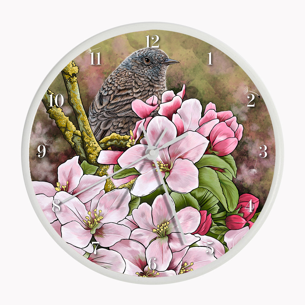 Our sustainable garden bird wall clock features an illustrated Dunnock surrounded by spring blossom
