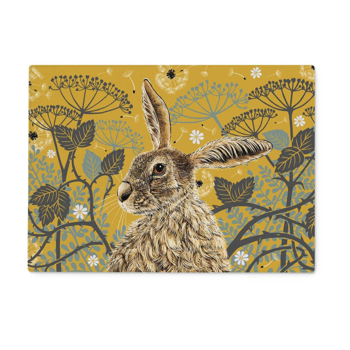 This rectangular hare tempered glass chopping board design features a hare portrait with one floppy ear, around the hare are stylised brambles, leaves, cow parsley and dandelion puffs, background colour is a mustard yellow.