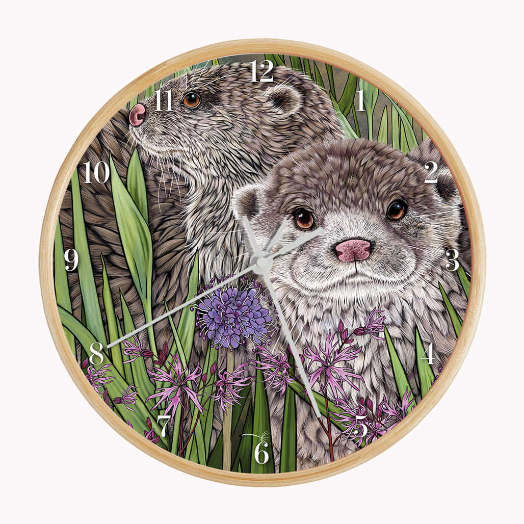 Otter Wall Clock featuring two illustrated otters among rushes and ragged robin flowers on a bamboo frame.