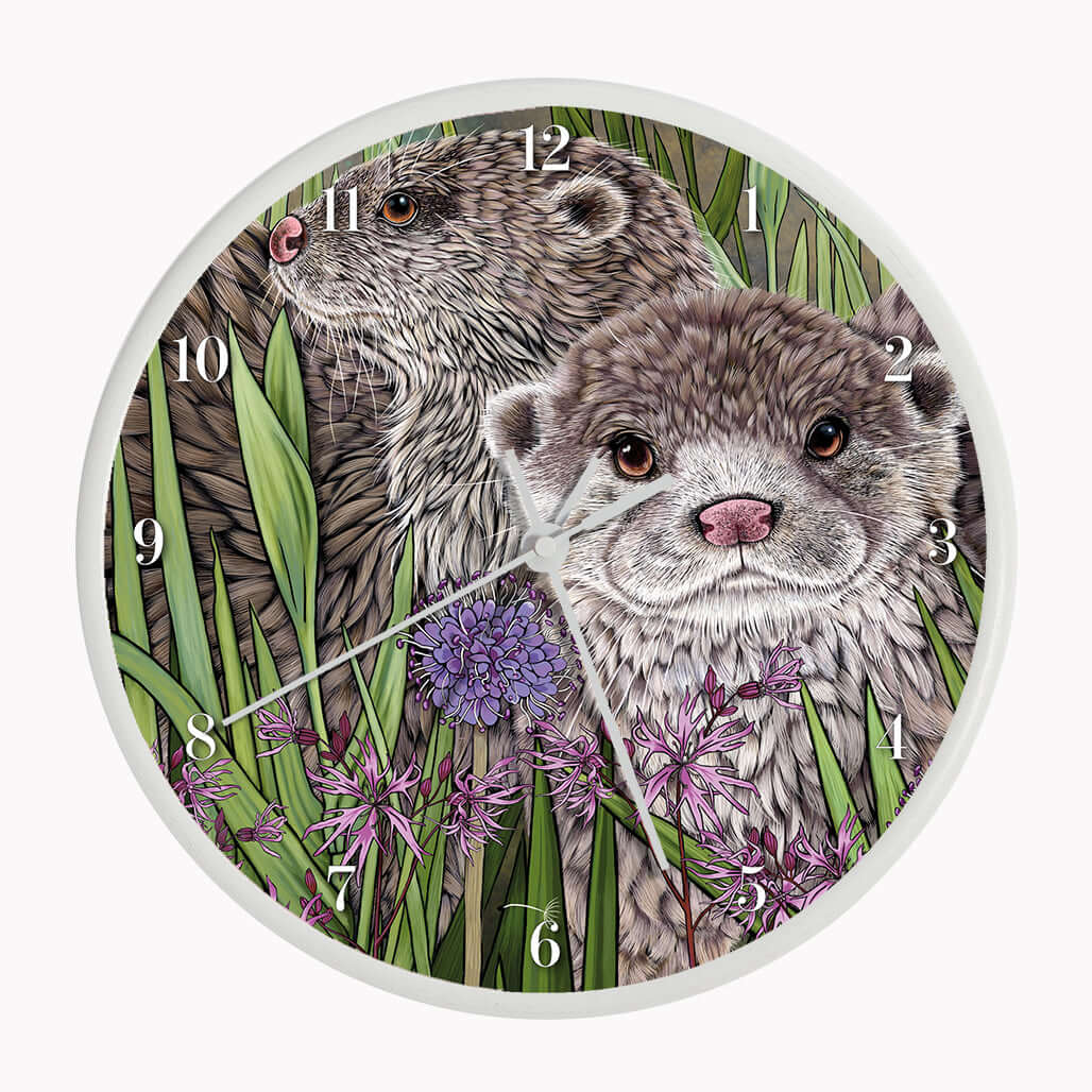 Otter Wall Clock featuring two illustrated otters among rushes and ragged robin flowers on a bamboo frame.