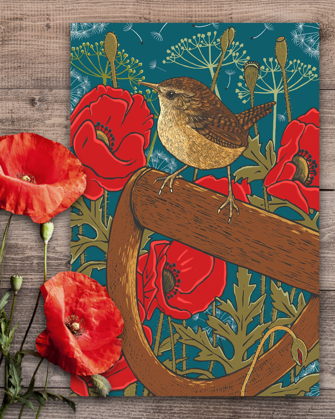 Poppies and Wren Tea Towel by Fox & Boo styled in a kitchen setting, featuring a wren perched on a garden spade among red poppies.