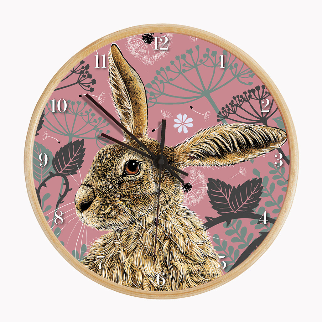 Sustainable hare wall clock - antique rose, hare surrounded by brambles and cow parsley on a pink background