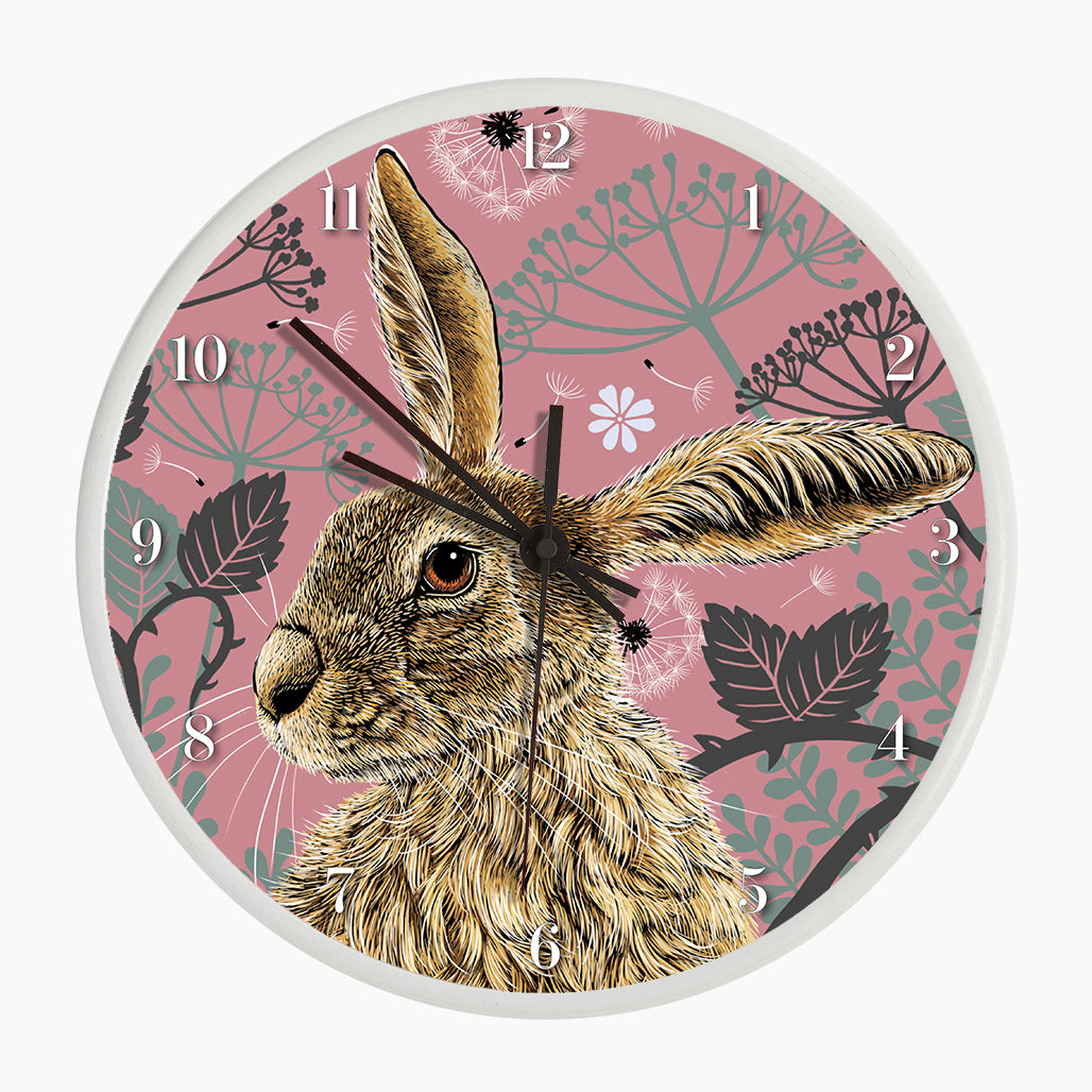 Sustainable hare wall clock - antique rose, hare surrounded by brambles and cow parsley on a pink background