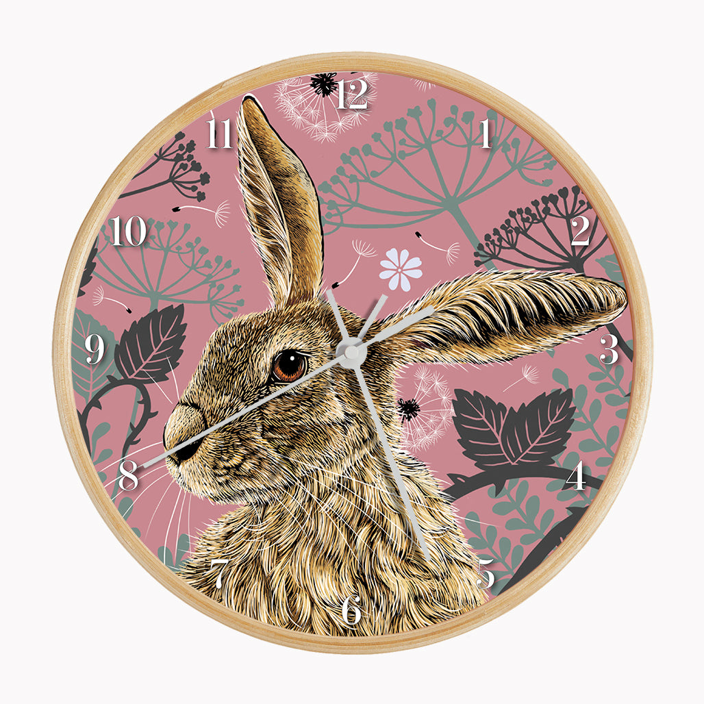 Sustainable hare wall clock - antique rose, hare surrounded by brambles and cow parsley on a pink background