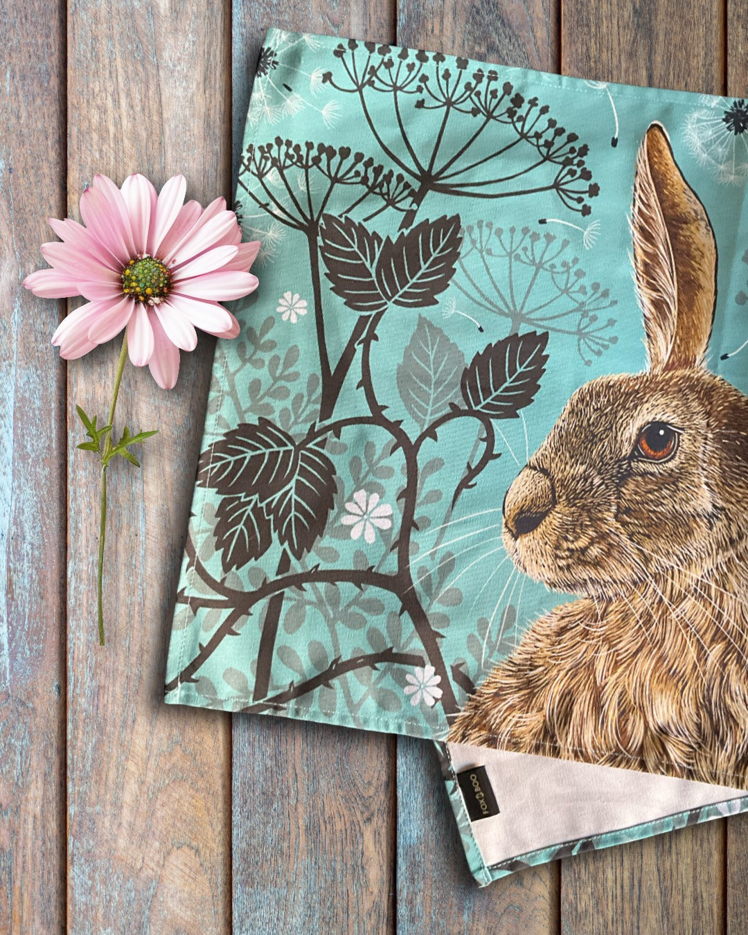 Woodland Hare Tea Towel by Fox & Boo, featuring a hare portrait on a vintage aqua background.