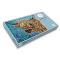 Sustainable Highland Cow Jigsaw puzzle box by Fox and Boo featuring a highland cow and thistles on a watercolour dark blue background