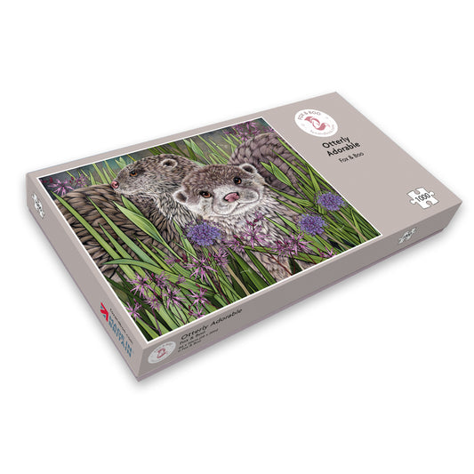 1000 piece illustrated sustainable otter jigsaw puzzle by Fox and Boo featuring otters amongst reeds and marsh flowers.