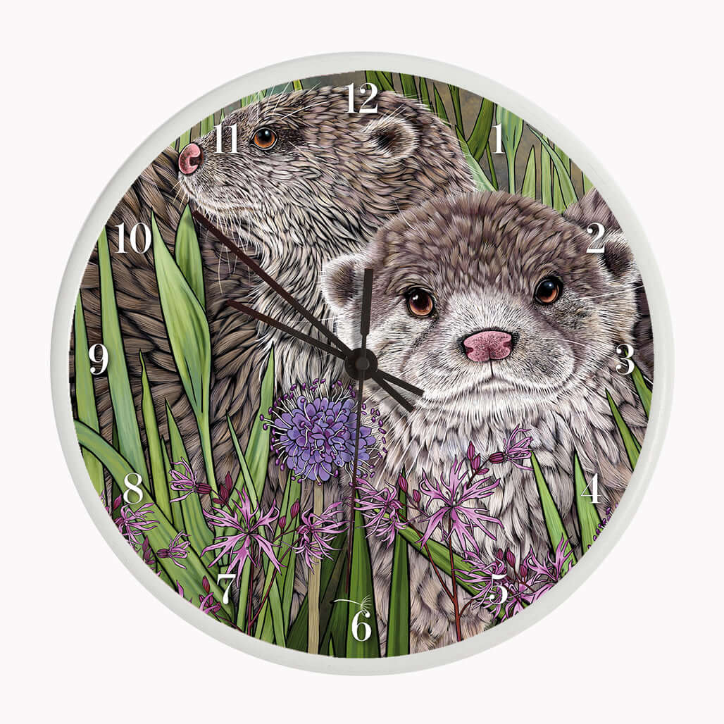 Otter Wall Clock featuring two illustrated otters among rushes and ragged robin flowers on a bamboo frame.