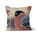 A square decorative throw pillow featuring a detailed illustration of a male bullfinch bird on a vintage-style beige background with postcard motifs and script text.